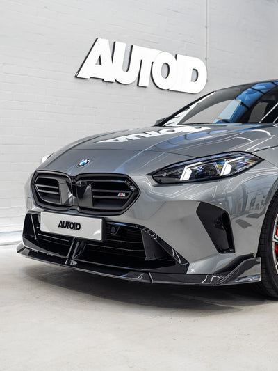 Gray BMW car with 'AUTOD' branding on a gray background
