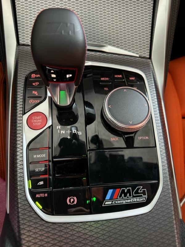 Car gear shift lever with control panel and M4 competition badge