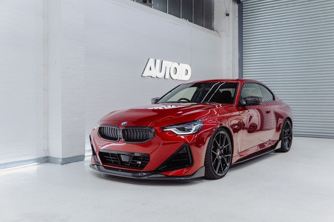 BMW G42 M240i red front three-quarter view with ADRO carbon fibre front splitter and side skirts