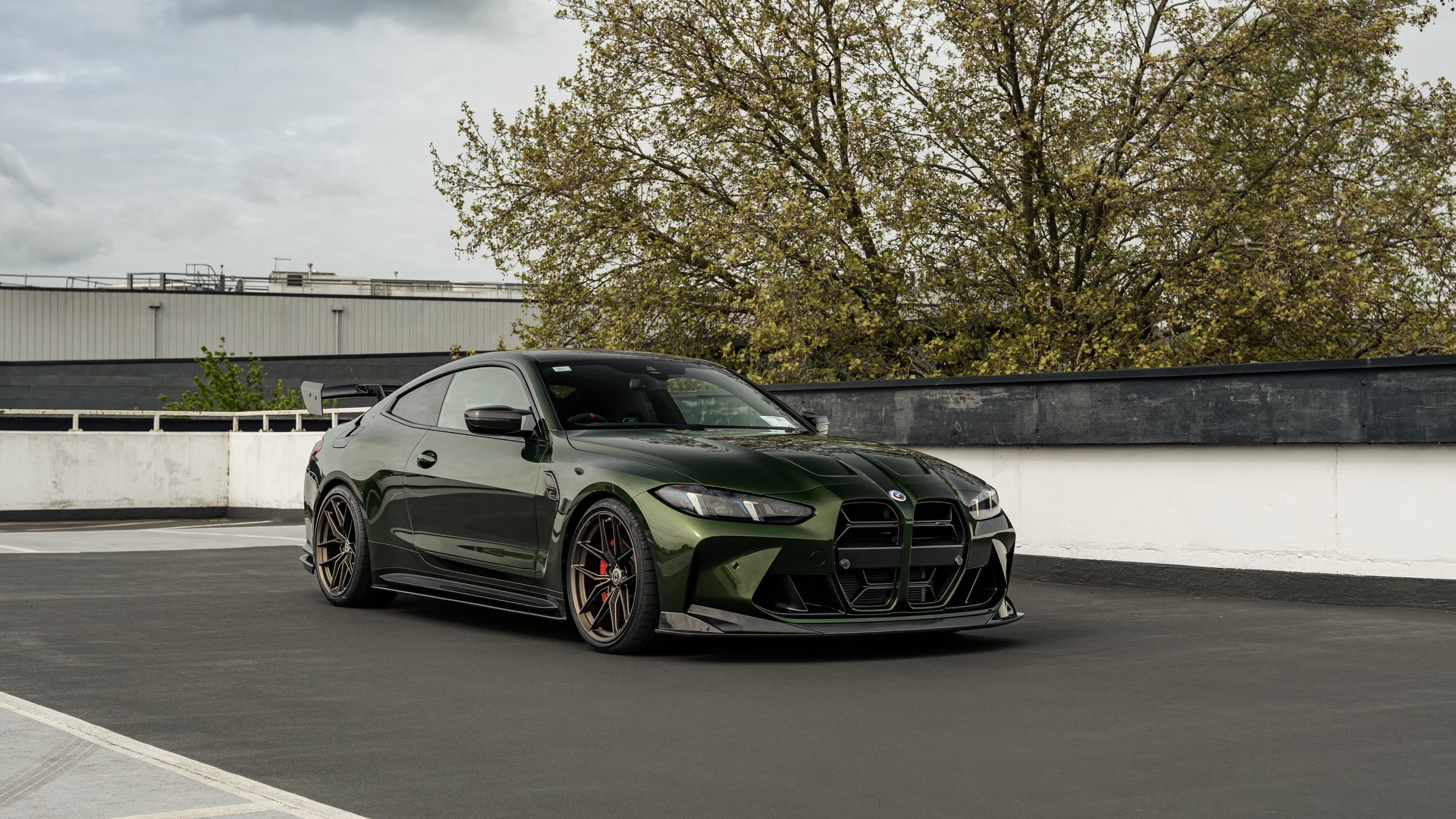 Modified BMW G82 M4 LCI with Trevora PR-1 Front Splitter and side skirts, CSL style grille and ADRO rear wing sat on HRE FF21 wheels and Eibach lowering springs