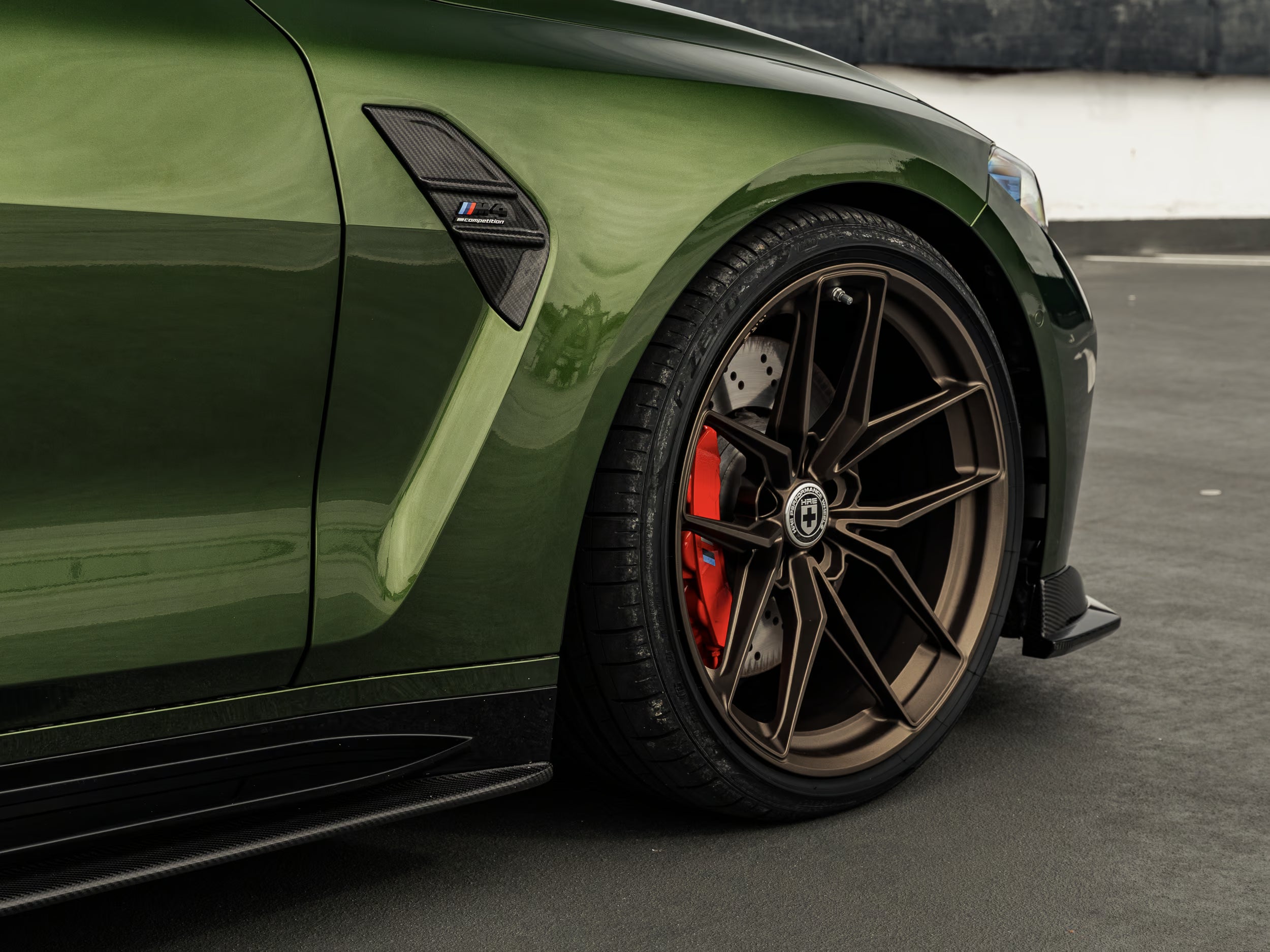 Modified Anglesea Green BMW G82 M4 LCI sat on HRE FF21 wheels and Eibach lowering springs