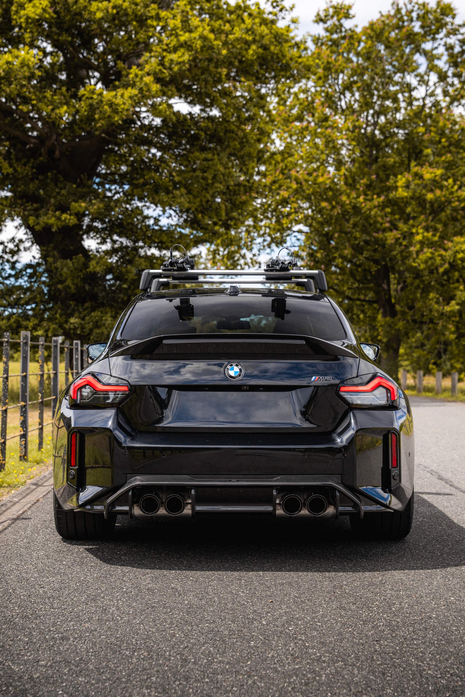 Rear of modified BMW G87 M2 LCI with ADRO Rear diffuser and boot spoiler lip