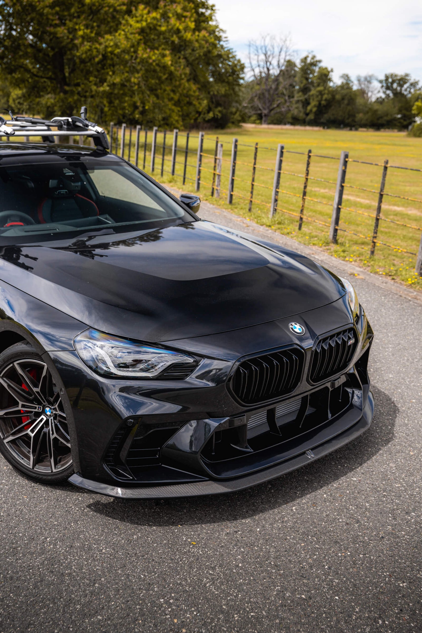 Front of BMW G87 M2 LCI with ADRO face-lift front bumper and carbon front lip