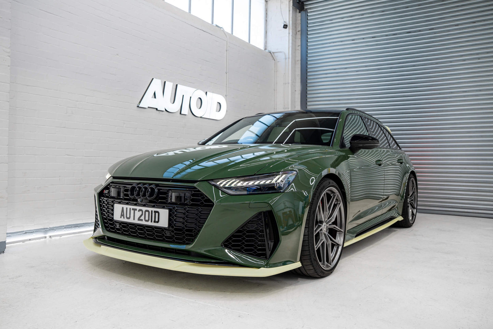 3D printed prototype body kit by Trevora on modified green Audi C8 RS6 in Autoid shop.