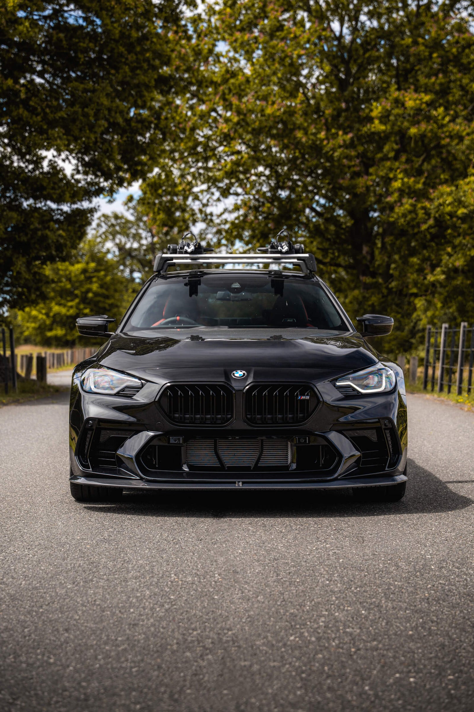 BMW G87 M2 with ADRO face-lift front bumper and carbon front lip