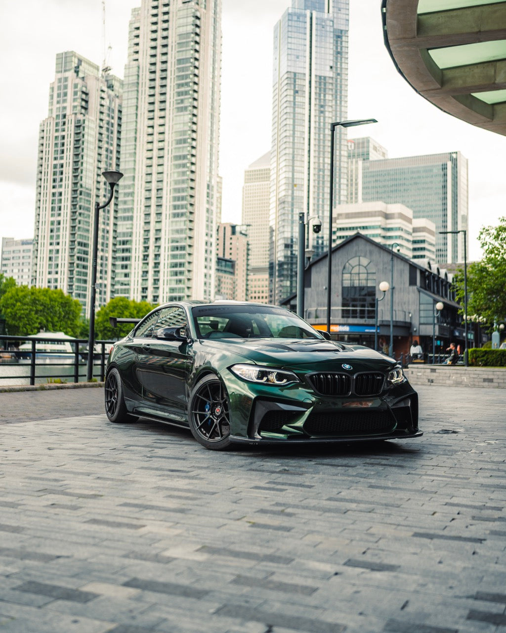 Modified BMW F87 M2 parked up in london with track aero