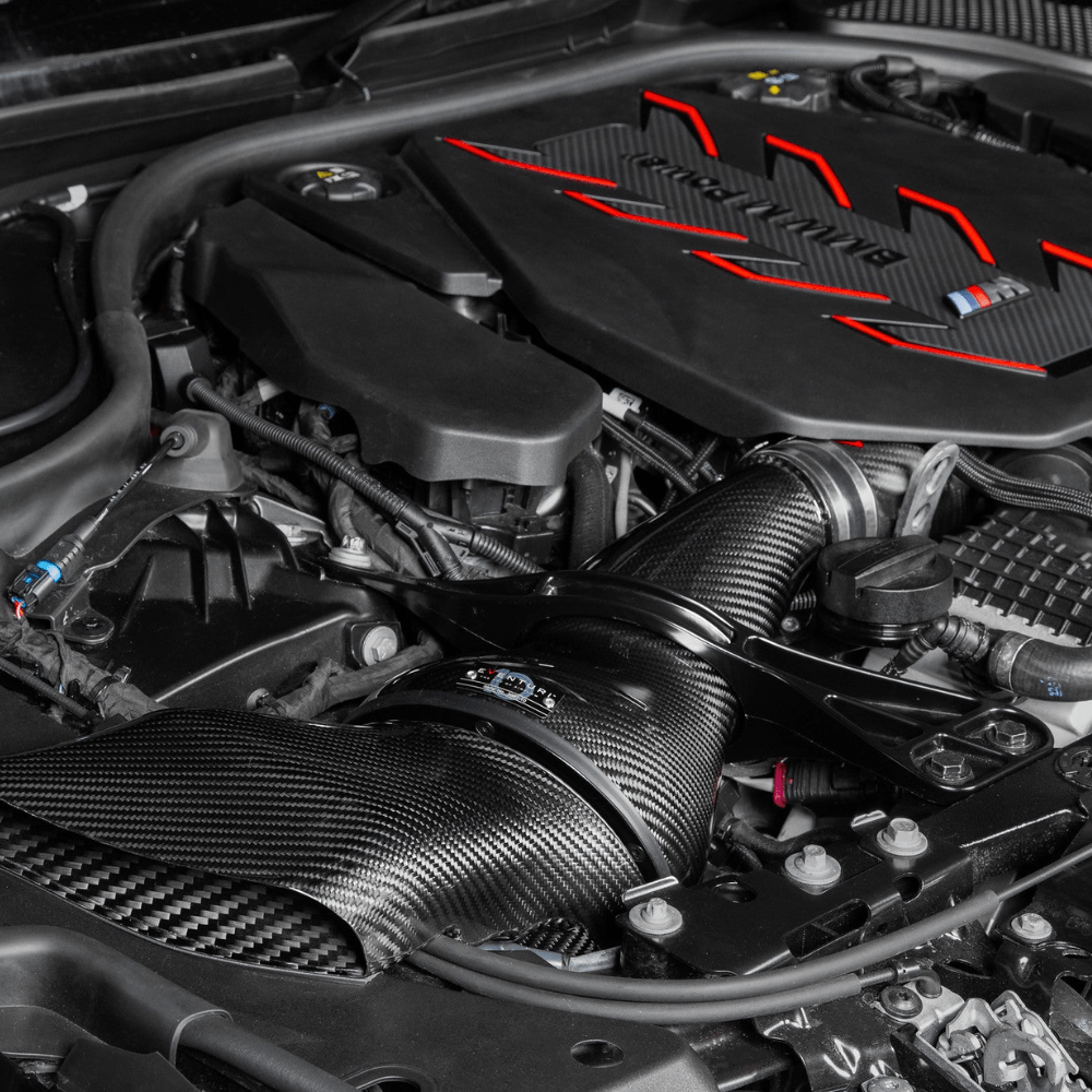 Car engine with a prominent brand logo on the cover