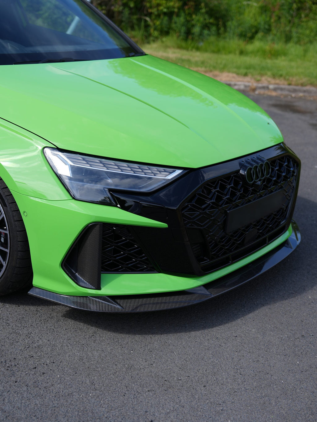 Audi RS3 8Y LCI Carbon Front Splitter — installed front three-quarter view