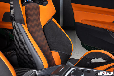 BMW G8X M Carbon Bucket Seat with Wunderworks Upper Bolster Protector Set installed